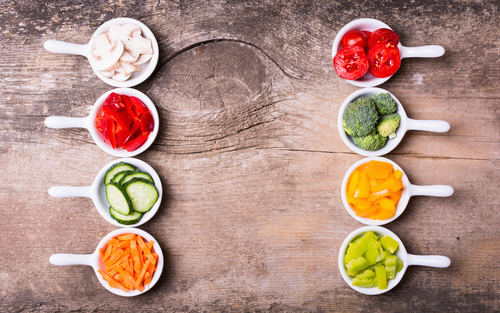 Slices of vegetables ( broccoli, mushrooms, carrots, cucumbers, tomatoes and pepper )